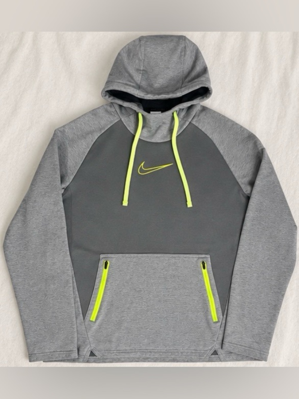 Nike Therma-FIT pullover hoodie in gray and charcoal with bright neon yellow acc